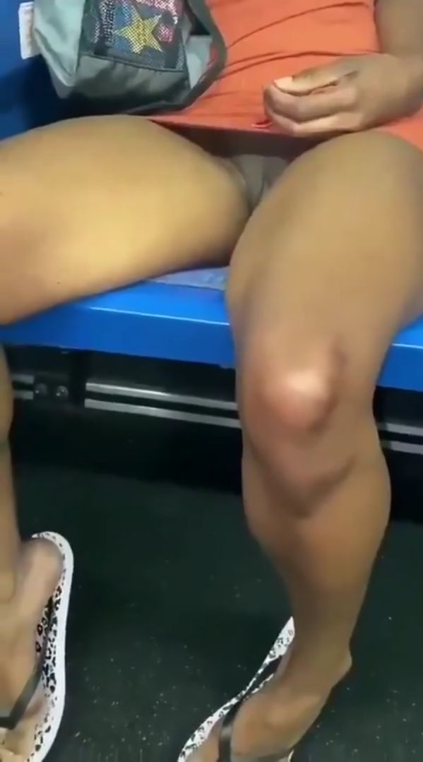 Pantiless ebony pornstar display her shaved pussy on train